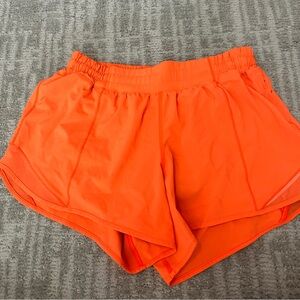 Lululemon hotty hot shorts, neon orange. Size 8 tall